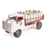 A vintage Tri-ang tinplate milk lorry.