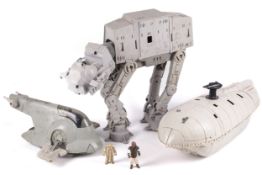 A collection of three vintage Star Wars vehicles.