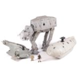 A collection of three vintage Star Wars vehicles.