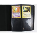 A collection of 66 assorted Pokemon cards in a binder.
