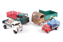 Four vintage toy trucks.