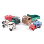 Four vintage toy trucks.