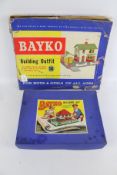 Two boxed Bayko buildings sets.