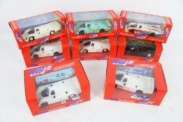 Eight Vitesse diecast models of Porsche 956 racing cars.