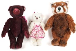 A collection of three Steiff teddy bears.