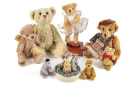 A collection of assorted teddy bears and Winnie the Pooh collectables.