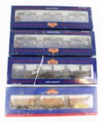 Four Bauchmann OO gauge sets of wagons.