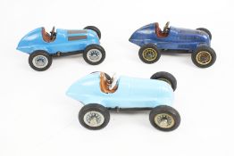 Three Schuco clockwork racing cars. Unboxed, with one key.