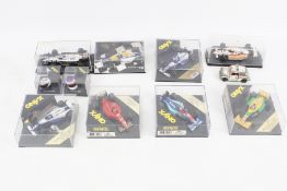 Eight Formula One diecast cars.