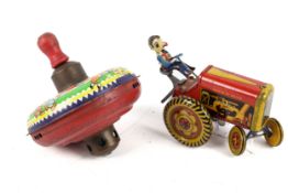 A vintage tinplate Met-Toy clockwork tractor and Chad Valley Spinner.