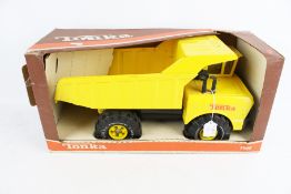 A Tonka 3900 Dumper Truck. In yellow trim and in original box.