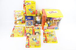 A group of assorted Simpsons collectable figures and toys.