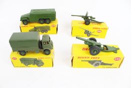 Four Dinky military vehicles.