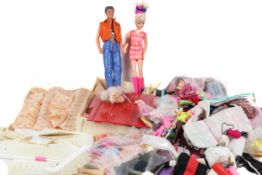 A vintage Sindy and Paul doll with accessories. Including clothing, pair of skis, furniture, etc.