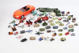 An assortment of diecast and model cars.