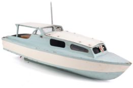 A vintage battery powered model boat.