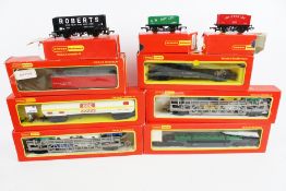 A large collection of Hornby OO gauge wagons and freight stock.
