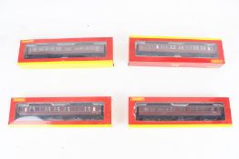 Four Hornby OO gauge coaches.