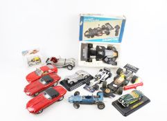 A collection of mostly unboxed diecast vehicles.