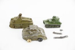 Three Dinky diecast tanks.