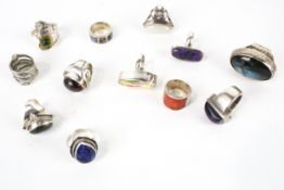 Twelve various gem set rings, mostly set in white metal.