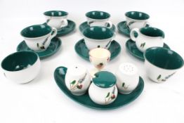 A Denby tea service in the 'Green Wheat' pattern. Including cups and saucers, shakers, bowls, etc.