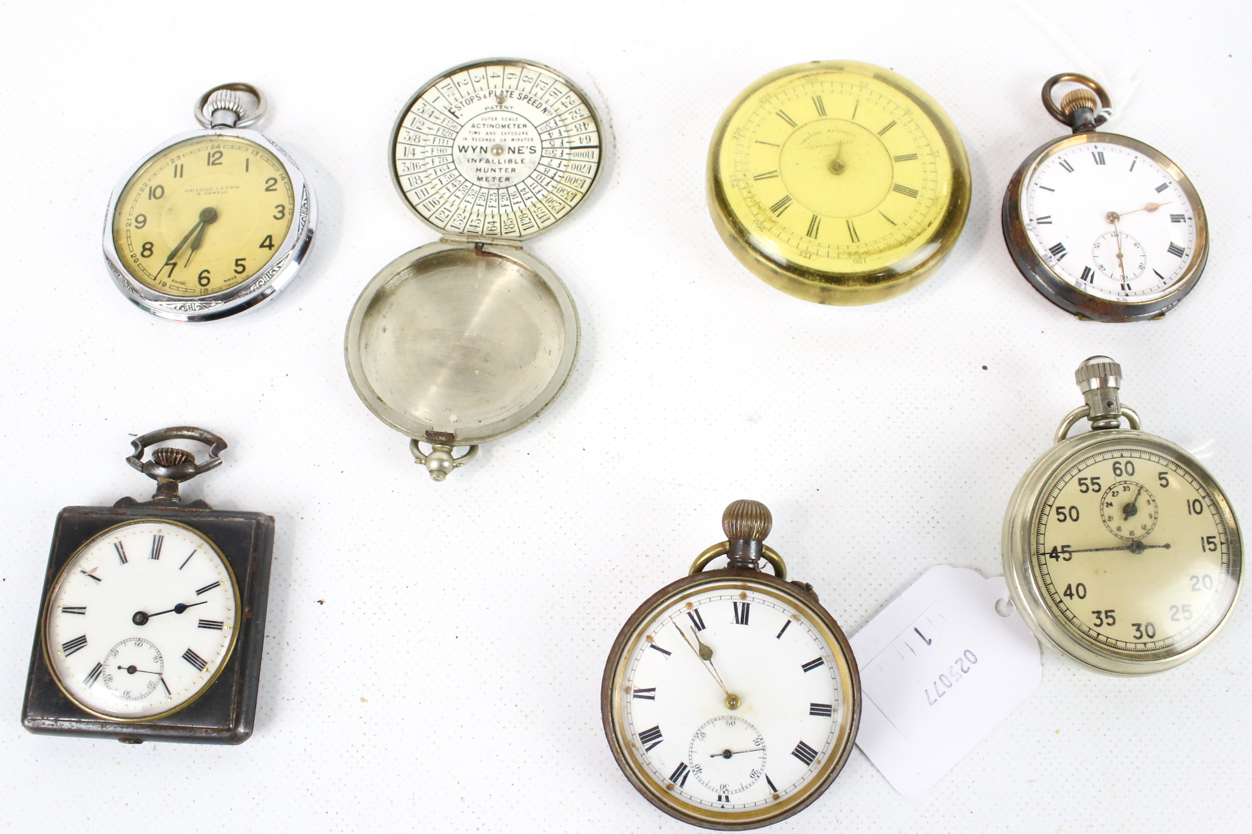 A collection of pocket watches and other items.
