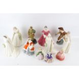 A collection of assorted Royal Doulton and Coalport china figures.