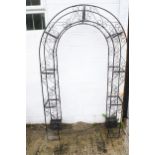 A metalwork garden archway.