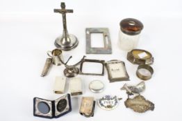 An INRI crucifix on a loaded base marked 'Sterling Silver' and other items.