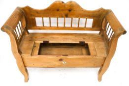 A vintage pine bench seat.
