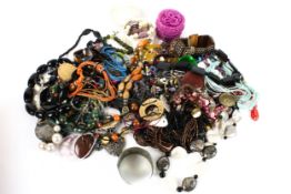 An assortment of costume jewellery. Including necklaces, bracelets, beads, etc.
