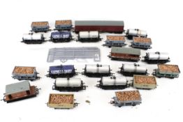 Twenty-two OO gauge railway model wagons.