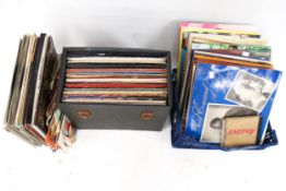 A collection of assorted 33 RPM vinyl LP records.