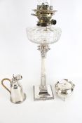 A collection of silver plate to include a Corinthian column candlestick later adapted as an oil