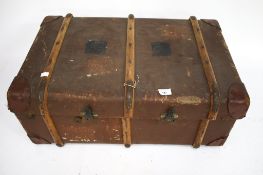 A vintage banded steamer trunk.