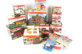 A collection of OO gauge buildings and track accessories.