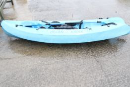 A Blue Ocean kayak with paddle.