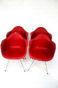Vintage Retro : A set of four Charles & Ray Eames designed mid century style ' DAR' red armchairs.