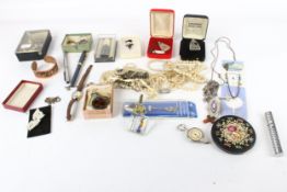 A small collection of costume jewellery to include a paste double-clip brooch.