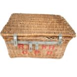 A large wicker basket with iron clasp and rope handles.