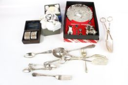 An assortment of silver plated items. Including flatware, napkin rings etc.