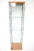 A shop glass display cabinet. With three glass shelves.