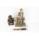 Three John Wayne collectables.