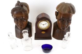A pair of carved oak busts, a mantel clock, scent bottles, etc.