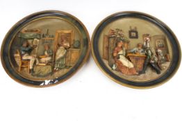 A pair of pottery plates of circular form, both featuring figures.