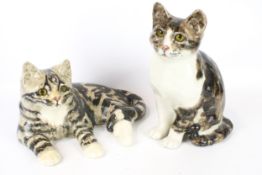 Two Winstanley pottery tabby cats. One in a seated position, the other lying down, Max.