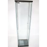 A commercial display cabinet. With glass sides and a lock to the door, H161.5cm x W42.