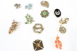 Assorted costume jewellery brooches and a Queen Victoria medallion