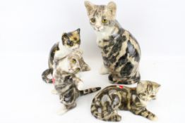 Four Winstanley pottery cats. In a variety of poses, Max.